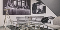 hazenkamp-livingroom-corner-sofa-glass-steel-coffee-table-al-pacino-wall-art.jpg