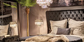 hazenkamp-bedroom-velvet-bed-with-head-panel-crystal-lamps.jpg