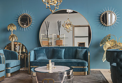 hazenkamp-livingroom-blue-sofa-blue-interior-xxl-mirror-round-gold-home-decoration.jpg