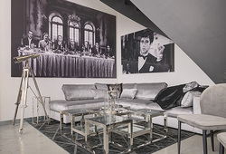 hazenkamp-livingroom-corner-sofa-glass-steel-coffee-table-al-pacino-wall-art.jpg